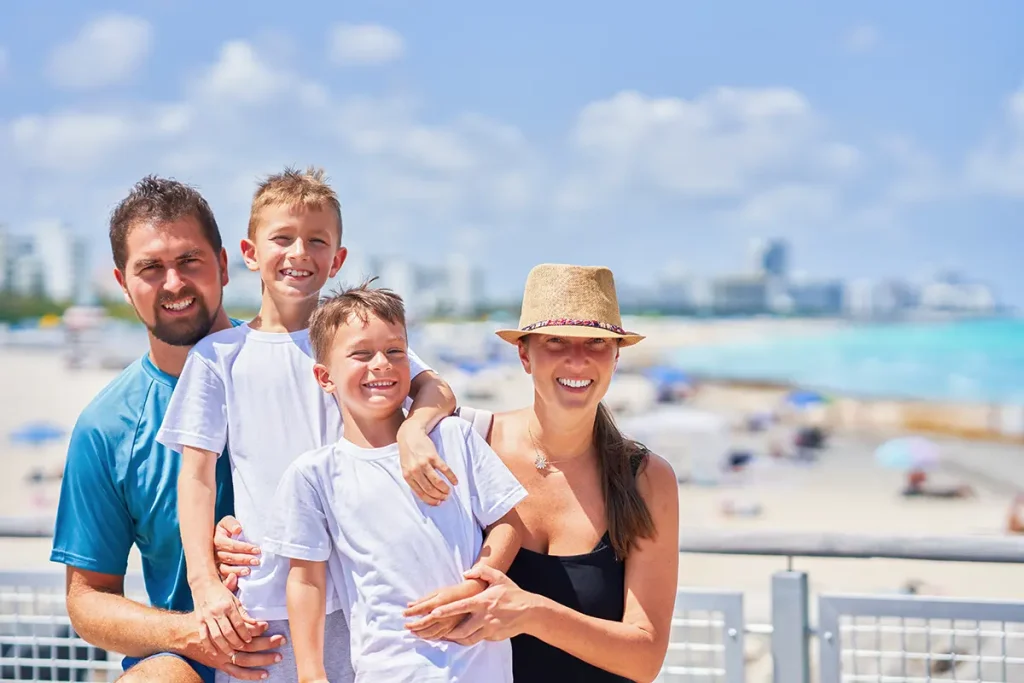 A happy young family enjoying their beach vacation in Florida.