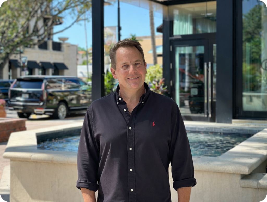 Photo of Marco Schmatloch, co-owner of VMS Florida Realty, in downtown Naples.